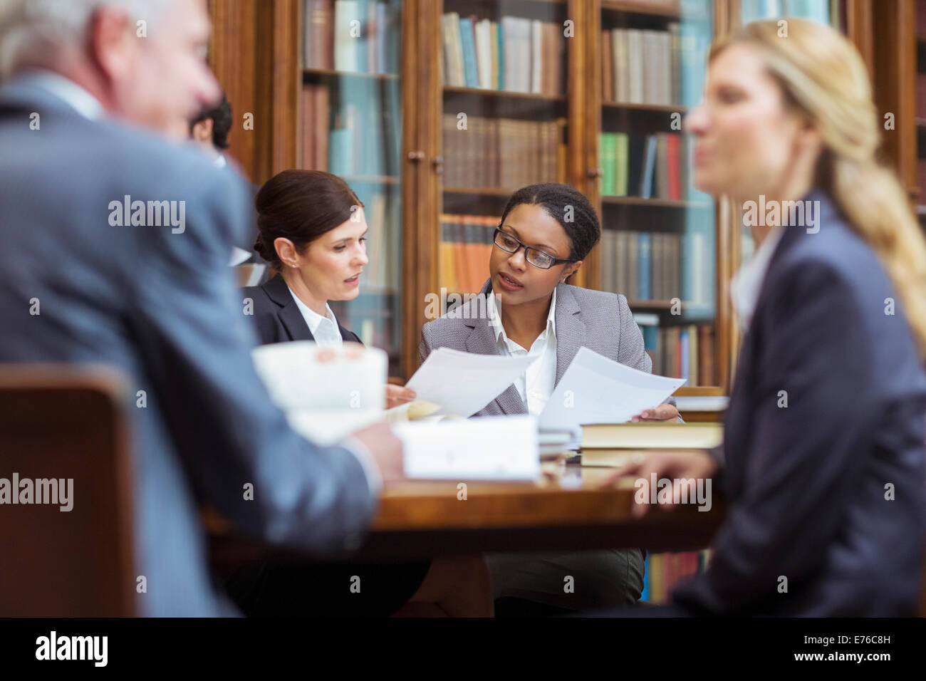Lawyers examining documents in chambers Stock Photo