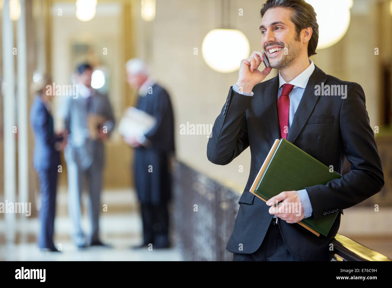Lawyer talking on cell phone in courthouse Stock Photo
