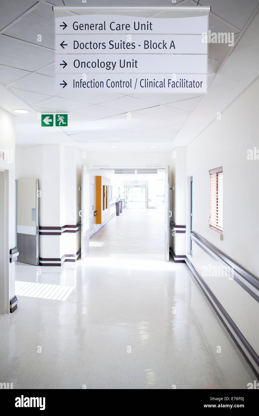 Signs in hospital hallway Stock Photo