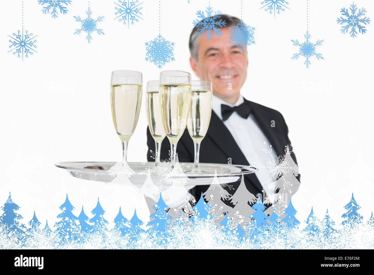 Composite image of waiter serving tray full of glasses with champagne Stock Photo