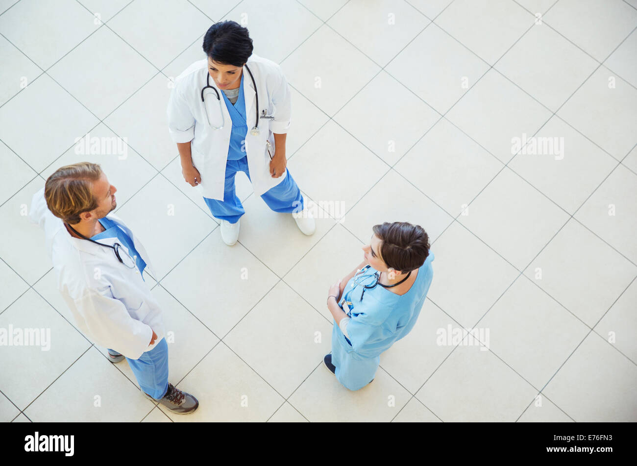 Doctors and nurse talking in hospital Stock Photo
