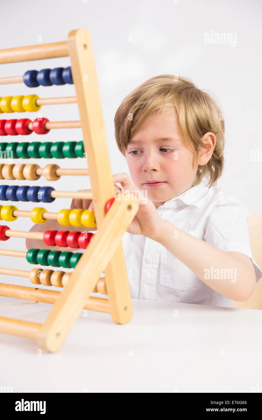 Student doing maths on abacus Stock Photo