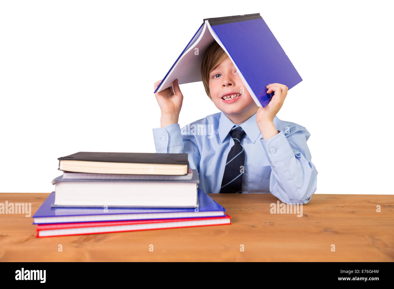 Student covering head with book Stock Photo Alamy