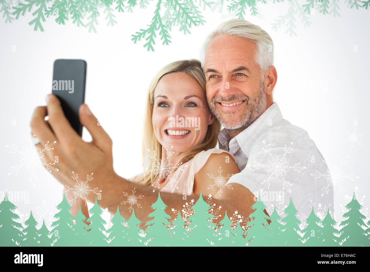 Composite image of happy couple posing for a selfie Stock Photo - Alamy