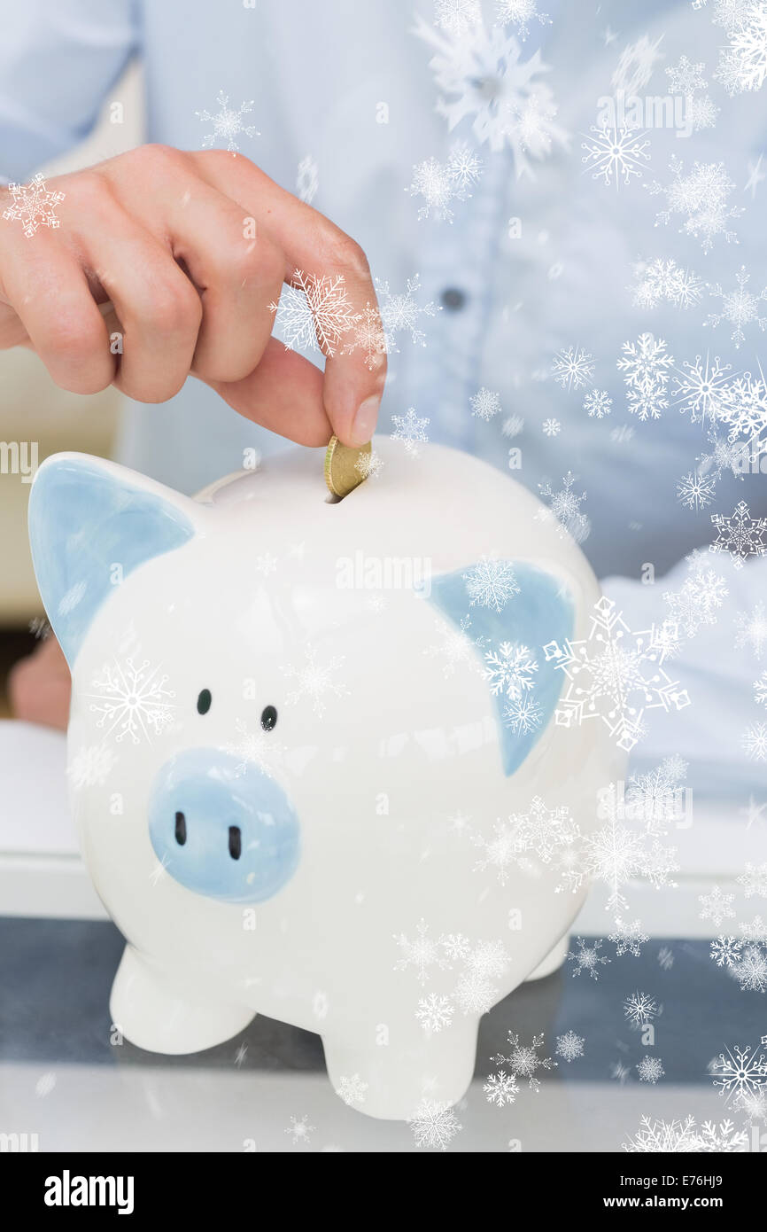 Man putting coin into piggy bank hi-res stock photography and images ...