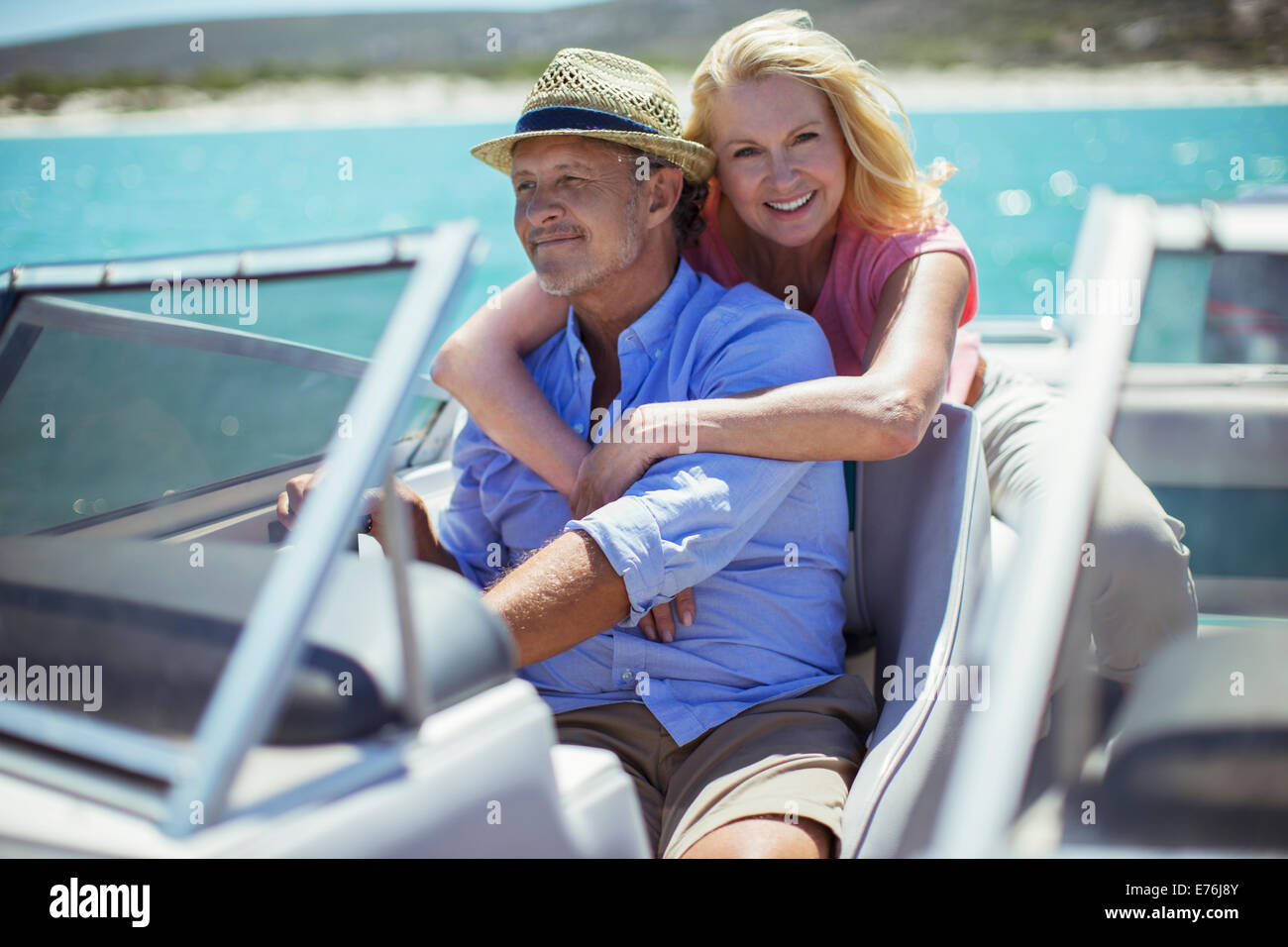 Older couple relaxing on boat Stock Photo