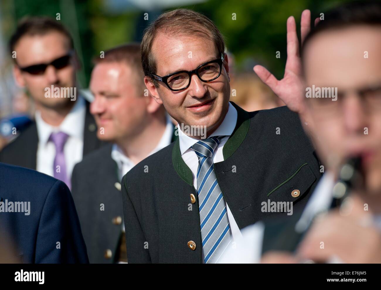 German Minister of Transport and Digital Infrastructure Alexander Dobrindt (CSU) greets accompanied by a band at the fairground of the political 'Gillamoos-Fruehschoppen' in Abensberg (Bavaria), Germany, 08 September 2014. The 'Gillamoos' is one of the biggest and oldest fairs in Lower Bavaria and traditionally hosts a vivid exchange of words between the political parties. PHOTO: SVEN HOPPE/dpa Stock Photo