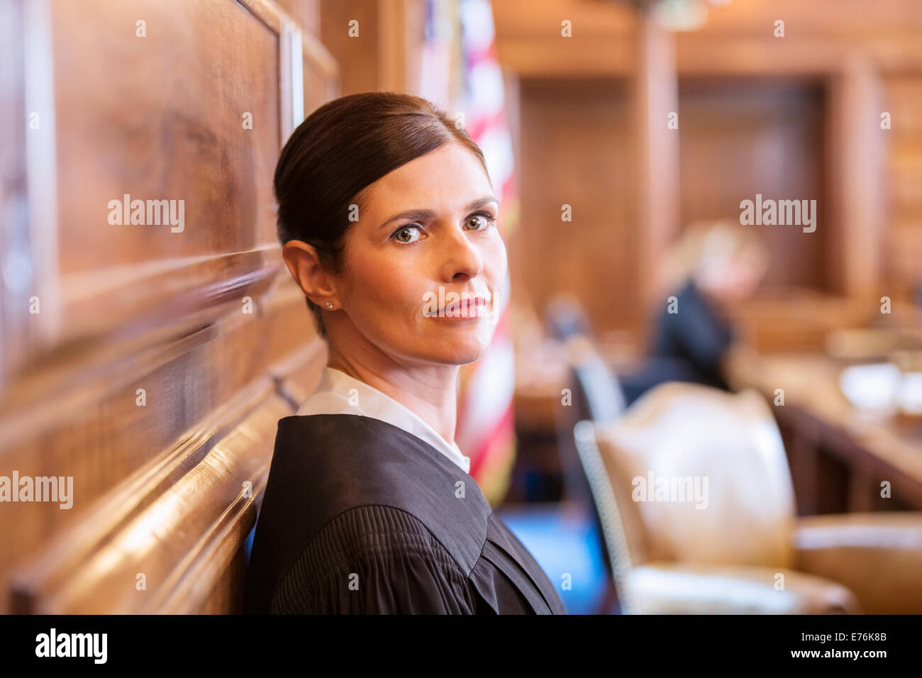 Judge standing in courtroom Stock Photo