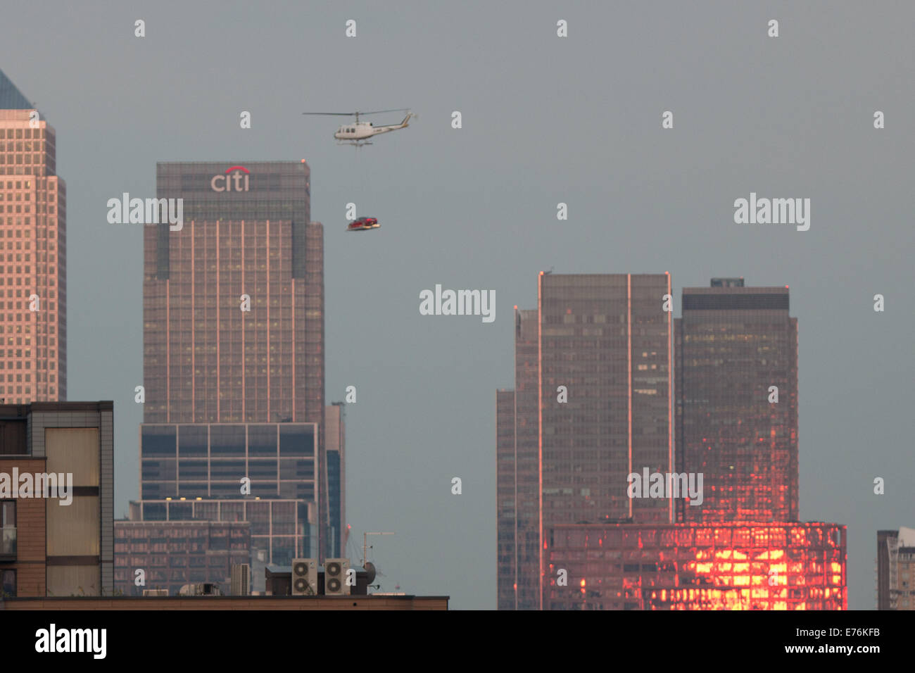 London UK 7th September 2014. Spectacular helicopter stunt, to launch new Jaguar XE, over Tower Bridge and Canary Wharf London. Stock Photo