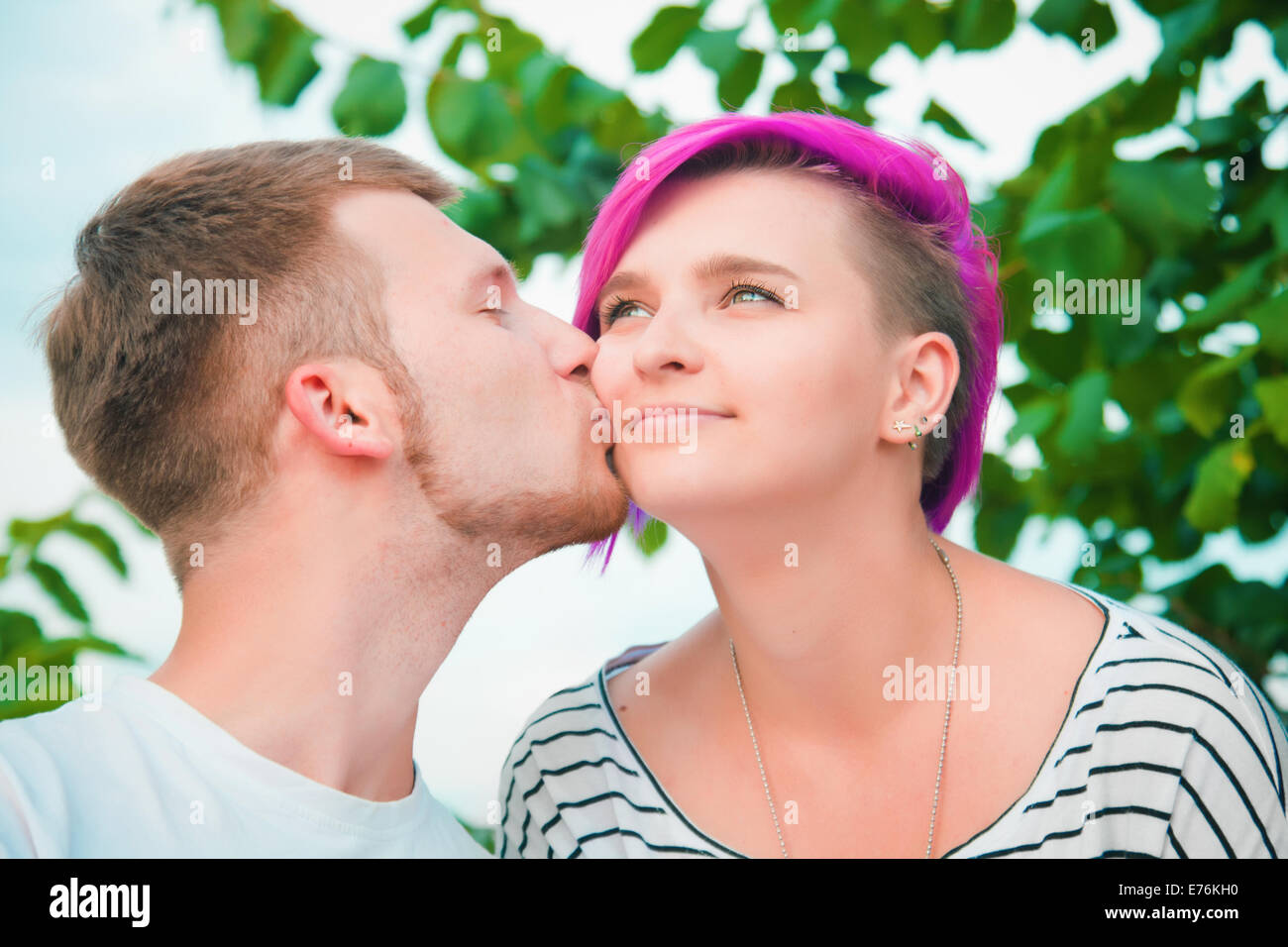 Man woman kissing cheek hi-res stock photography and images - Alamy