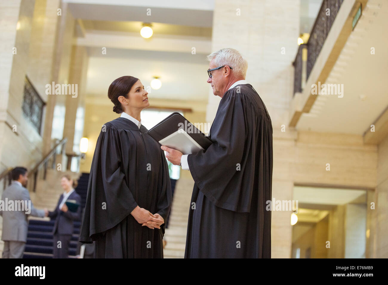 Judges talking in courthouse Stock Photo