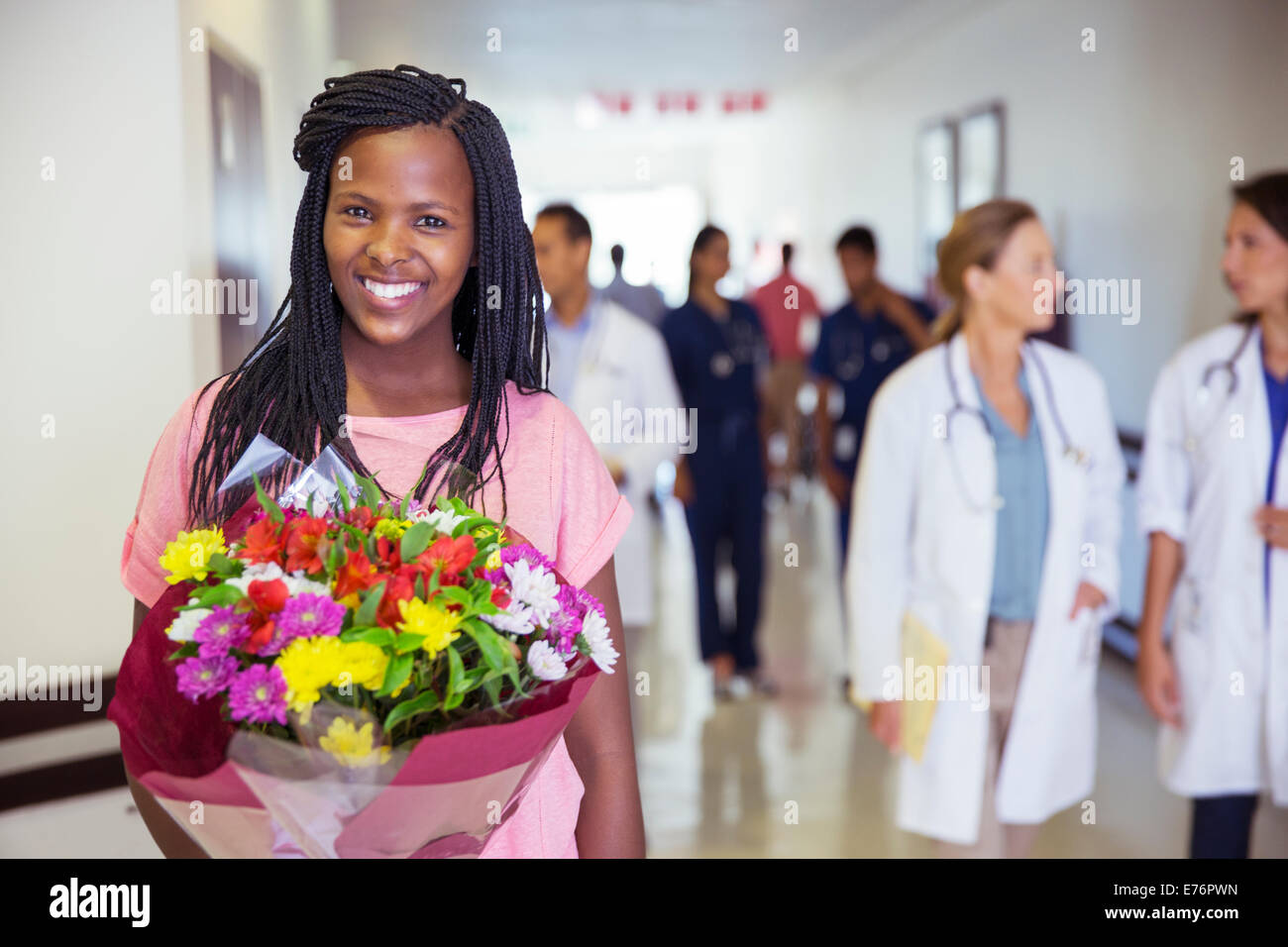 Patient holding bouquet of flowers in hospital Stock Photo Alamy