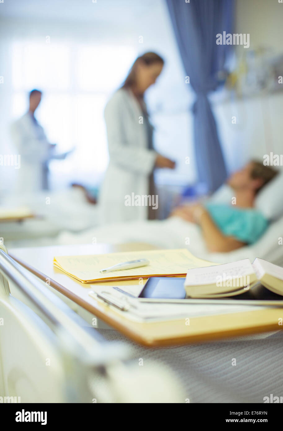 Close up of books on hospital bed tray Stock Photo