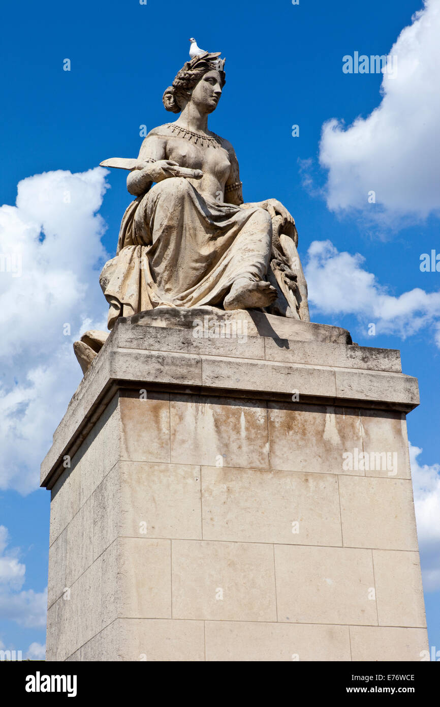 One of the statues on Pont du Carrousel in Paris, France Stock Photo