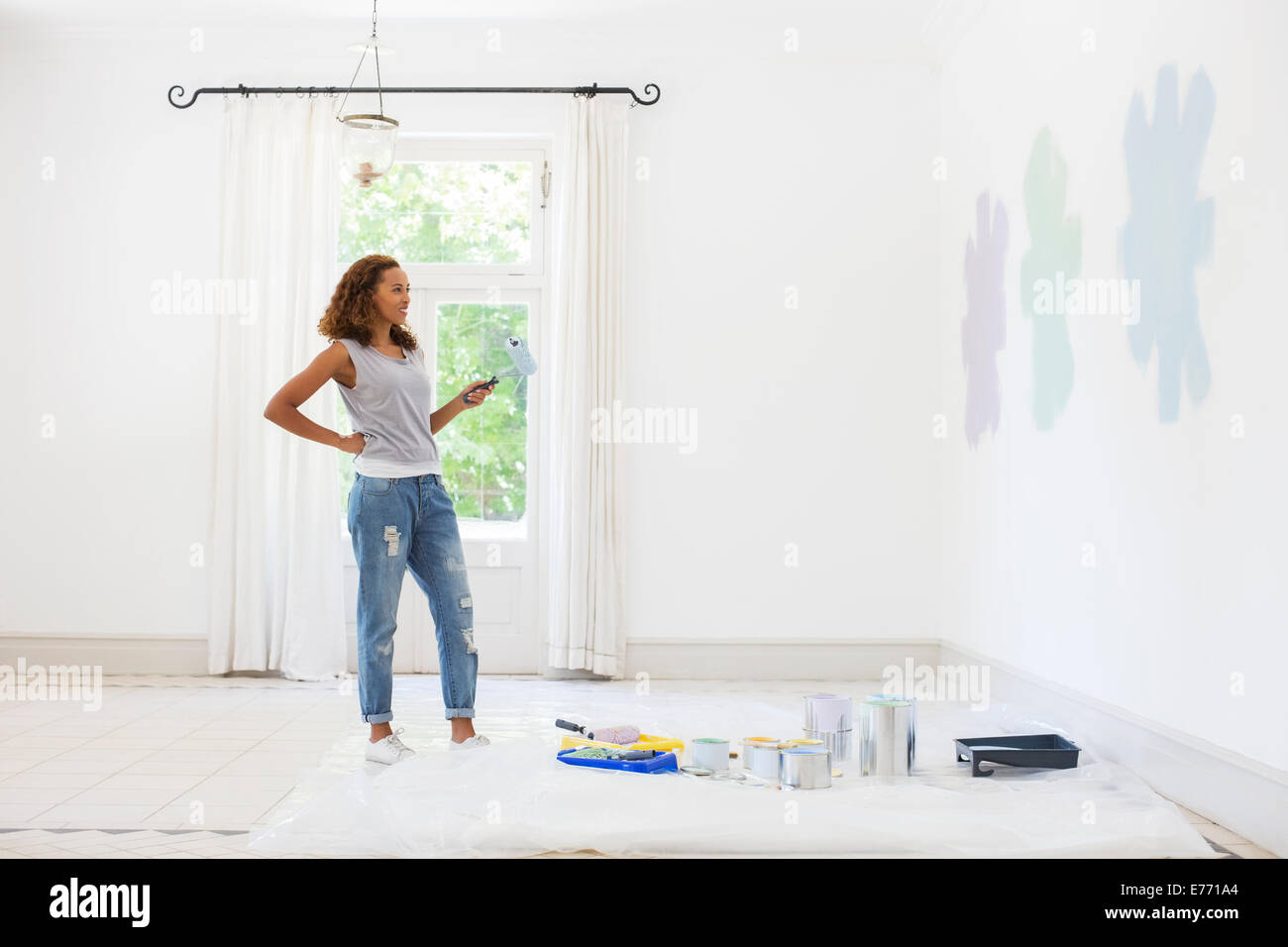 Woman observing paint swatches Stock Photo