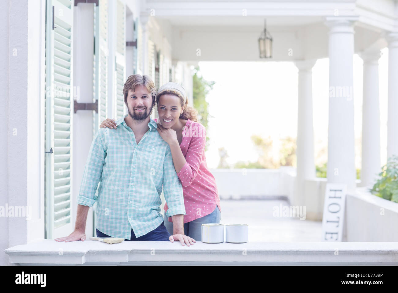 Couple hugging on porch Stock Photo