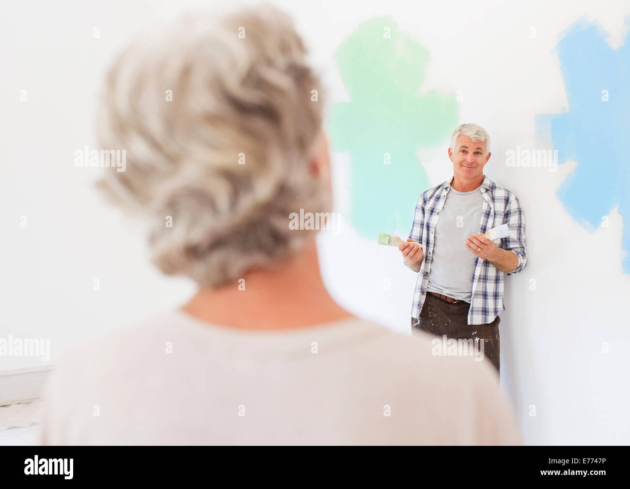 Older couple deciding on paint colors together Stock Photo