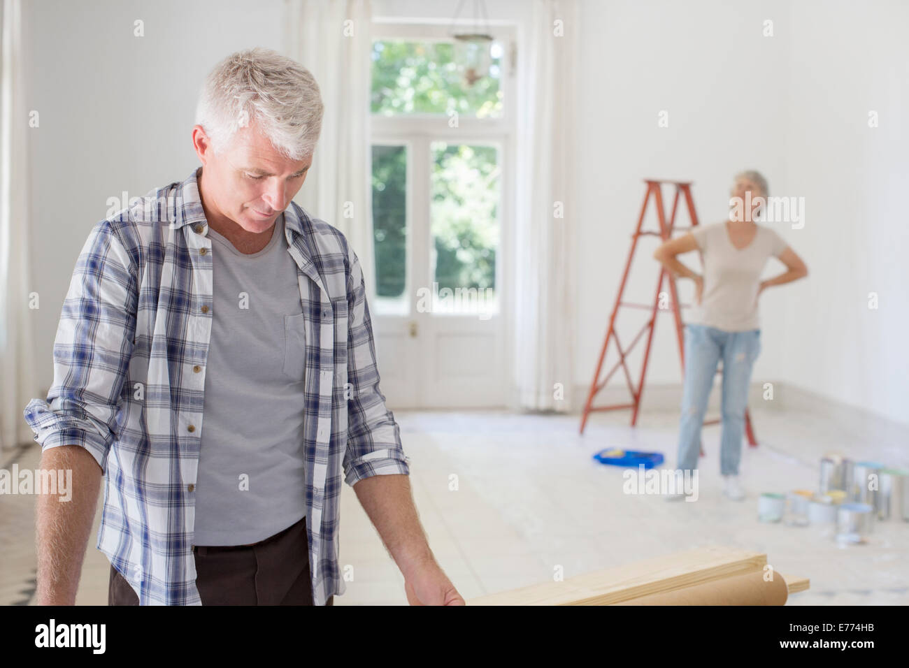 Older couple observing new living space Stock Photo