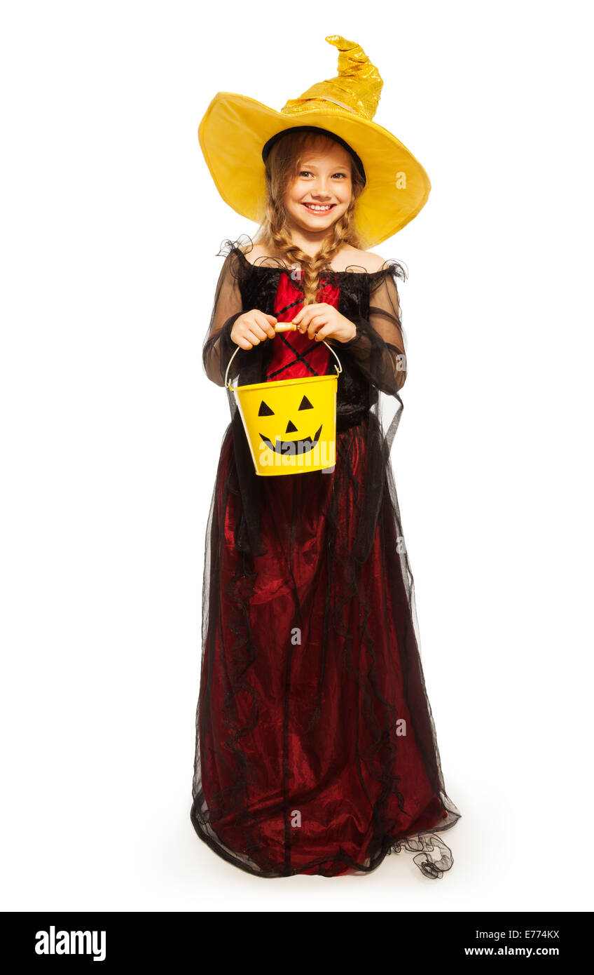 Girl wearing Halloween witch costume with bucket Stock Photo Alamy