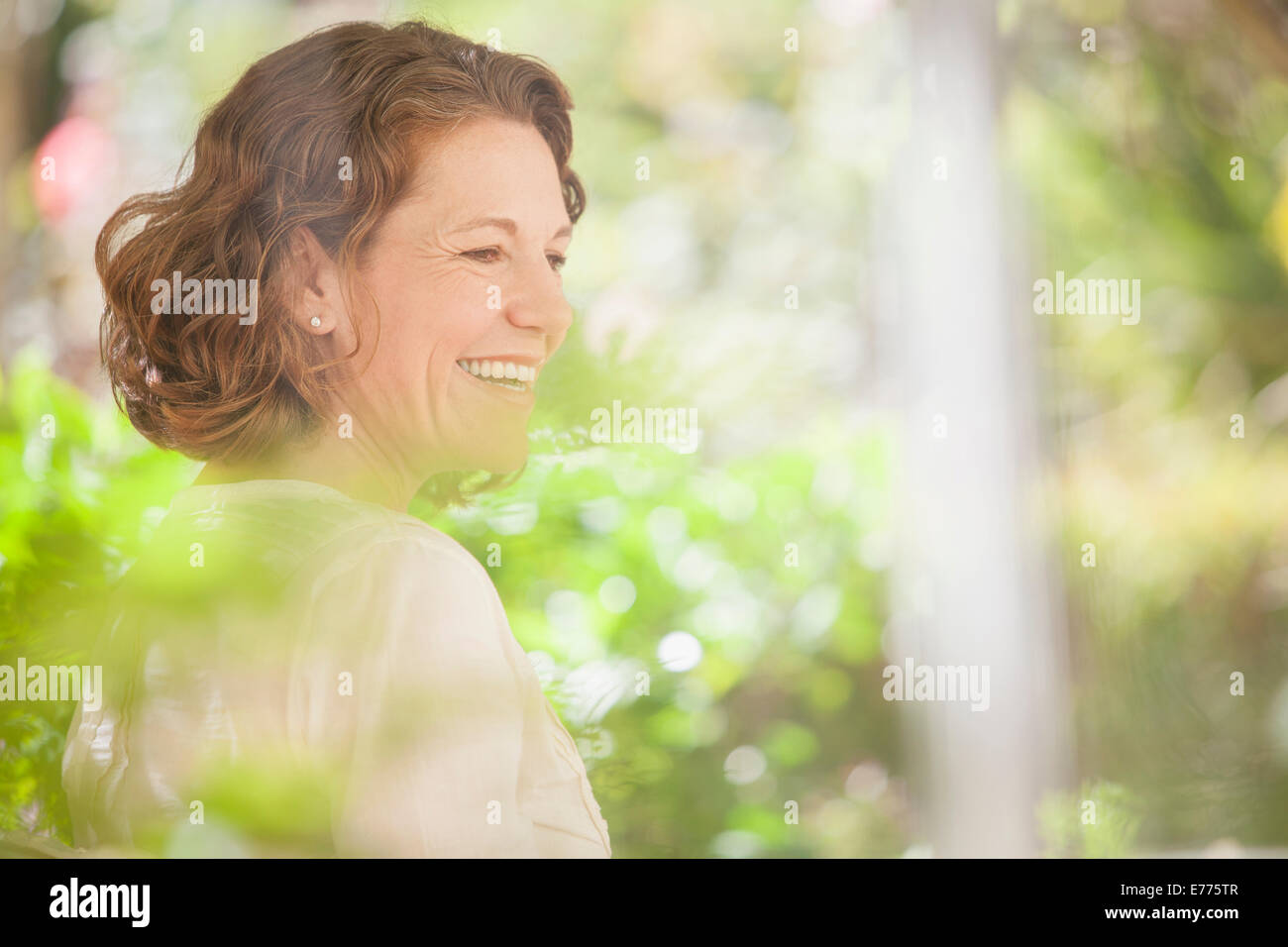 Older woman smiling outdoors Stock Photo