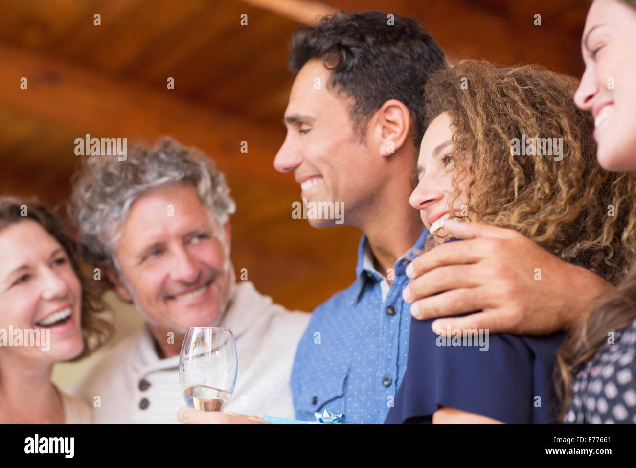 Family laughing together indoors Stock Photo