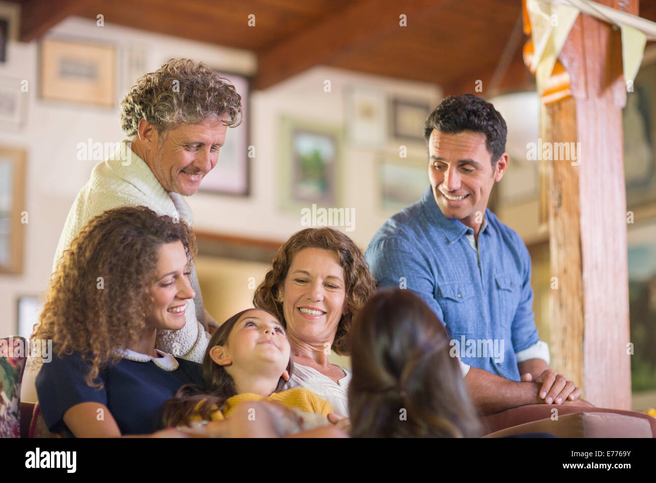 Family gathered on the couch together Stock Photo
