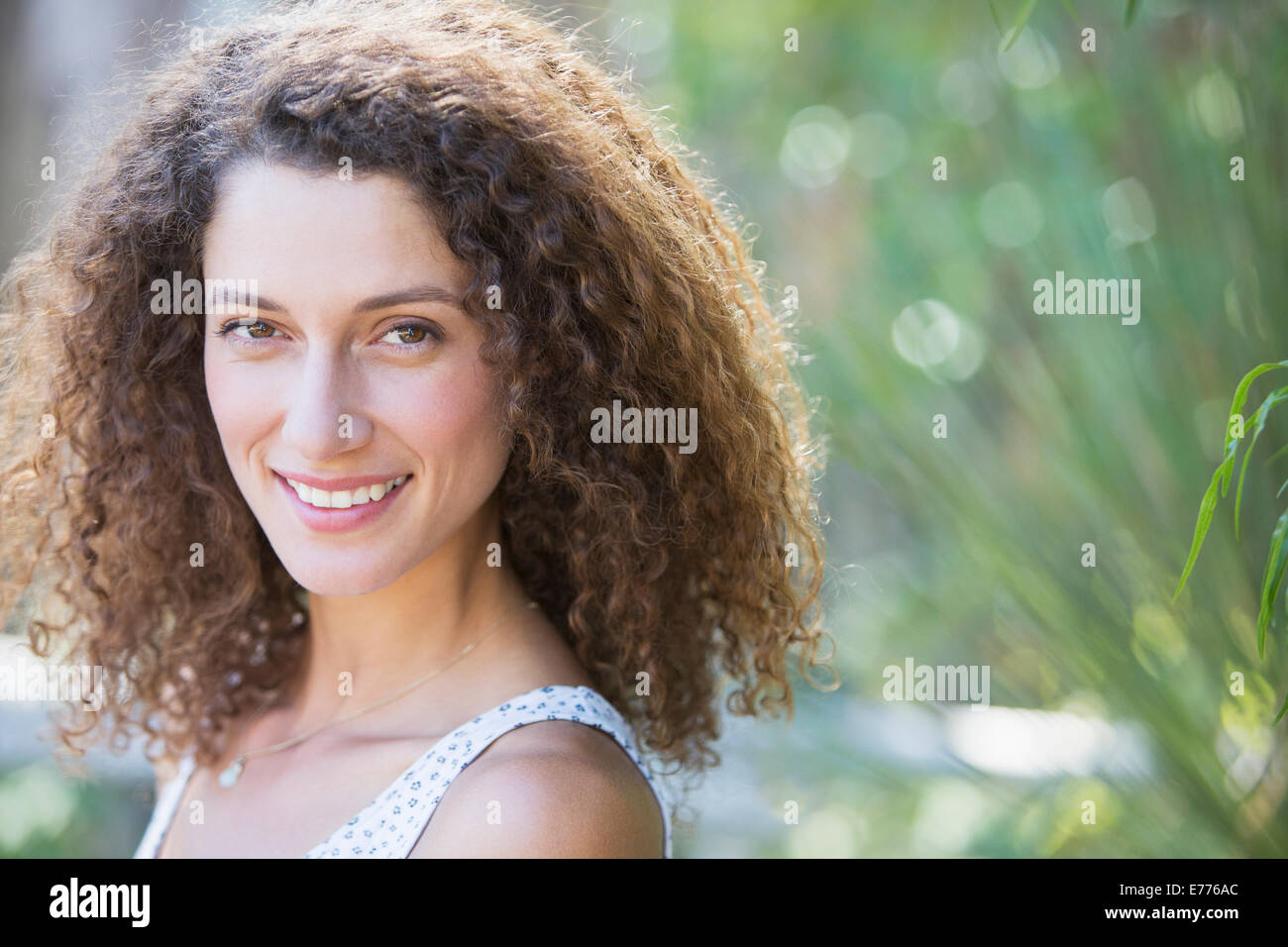 Woman smiling outdoors Stock Photo