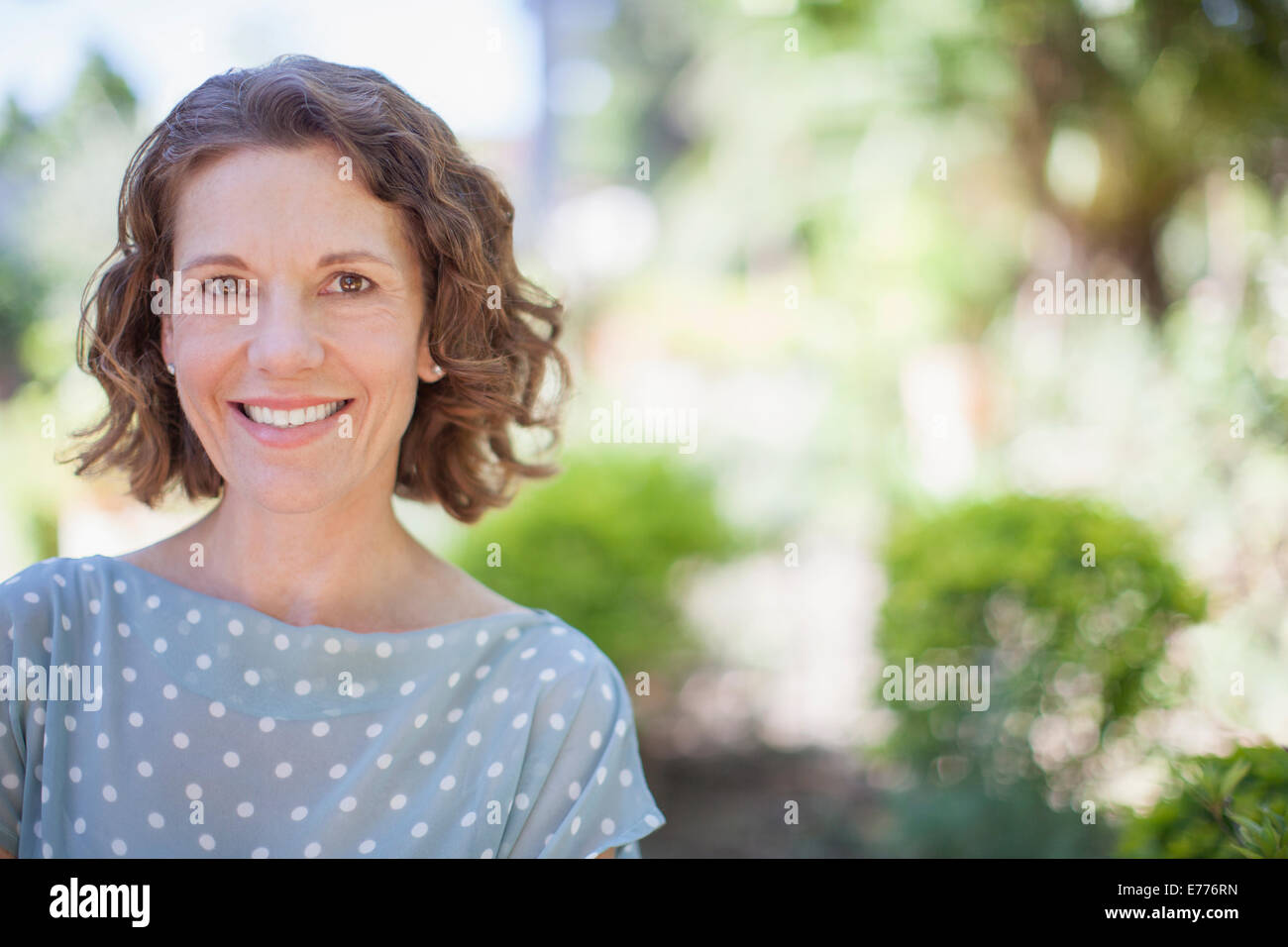 Older woman smiling outdoors Stock Photo