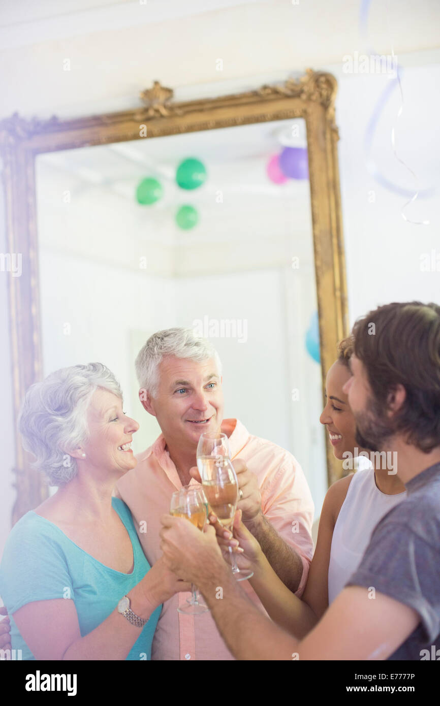 Family celebrating with drinks Stock Photo