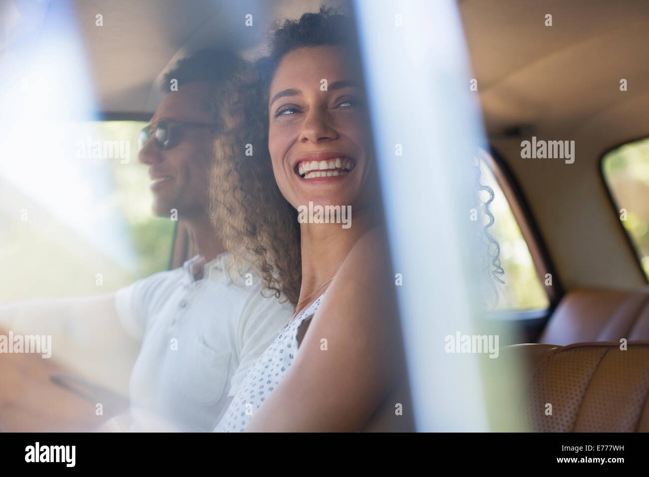 Woman riding in car with boyfriend Stock Photo