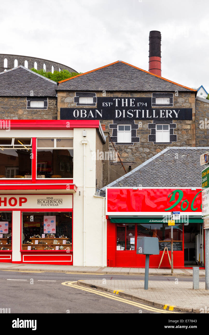 The Oban Distillery with McCaig's Tower behind it, Oban, Argyll & Bute