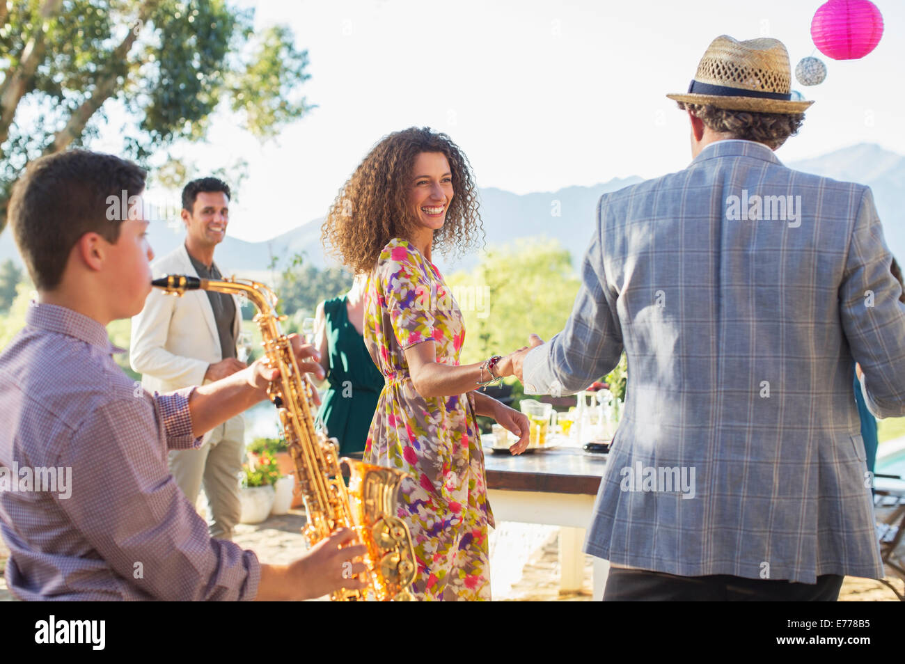 Father and daughter dancing outdoors Stock Photo