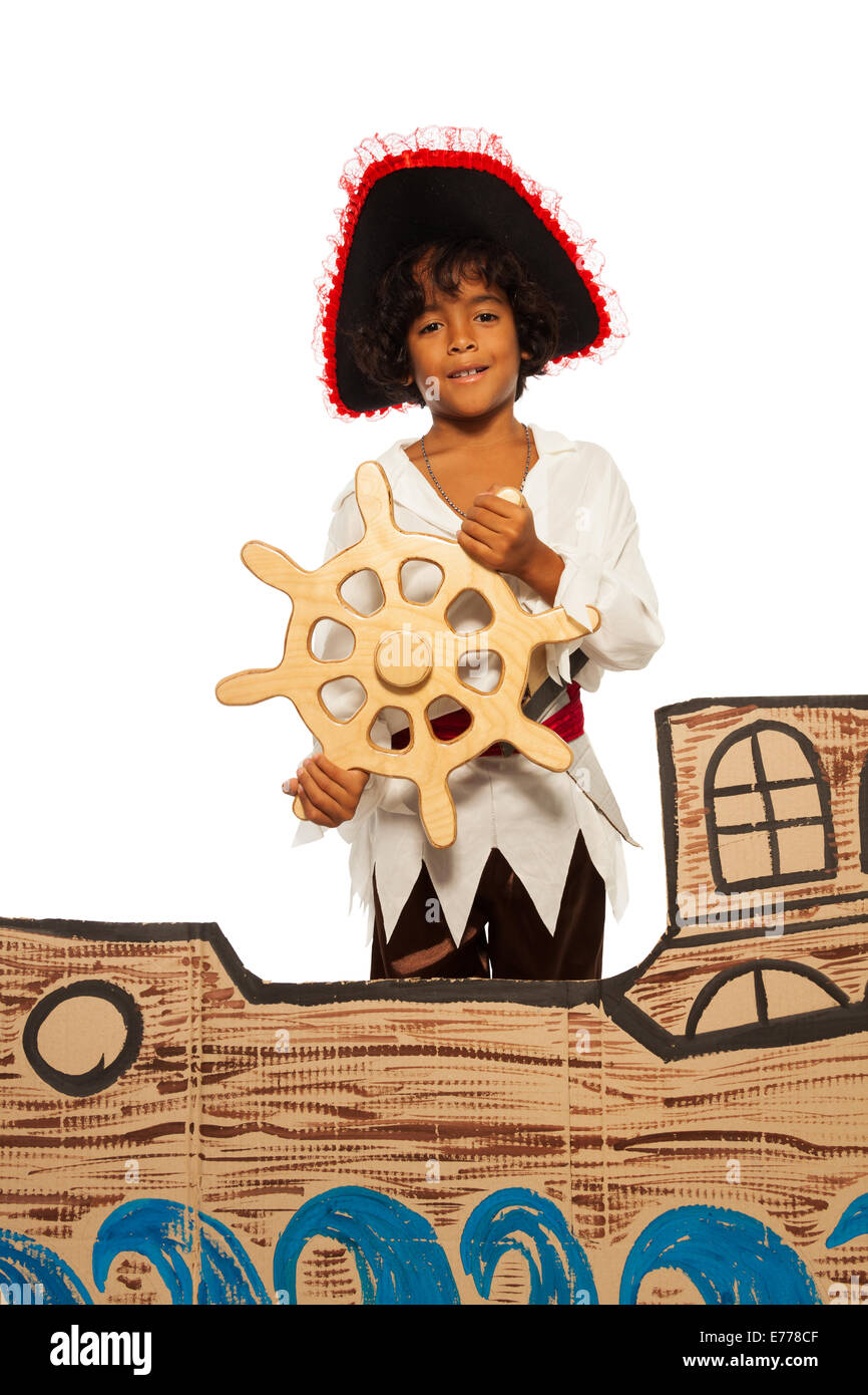 Little boy playing being pirate on cardboard ship Stock Photo