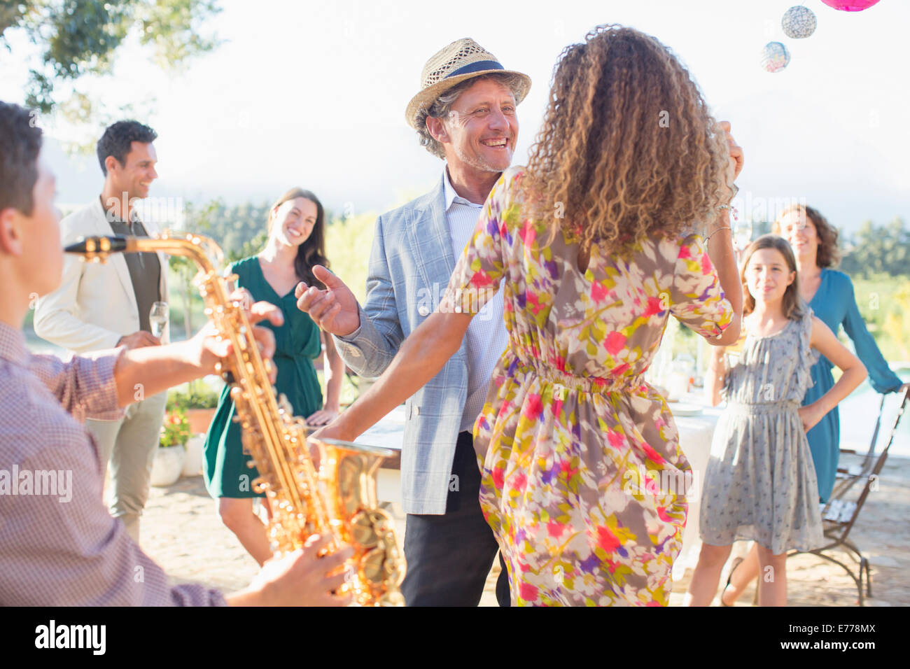 Father and daughter dancing together Stock Photo