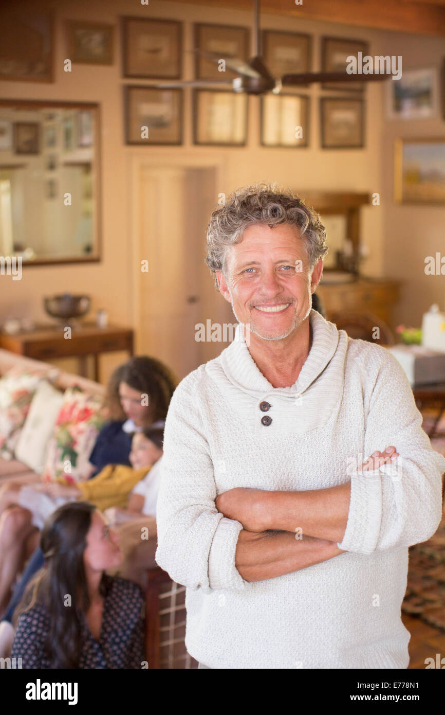 Older man smiling with family near Stock Photo