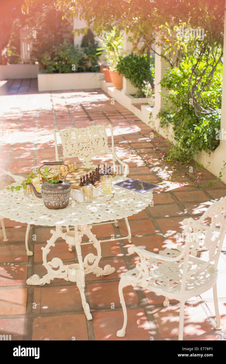 Outdoor dinning table on backyard patio Stock Photo - Alamy