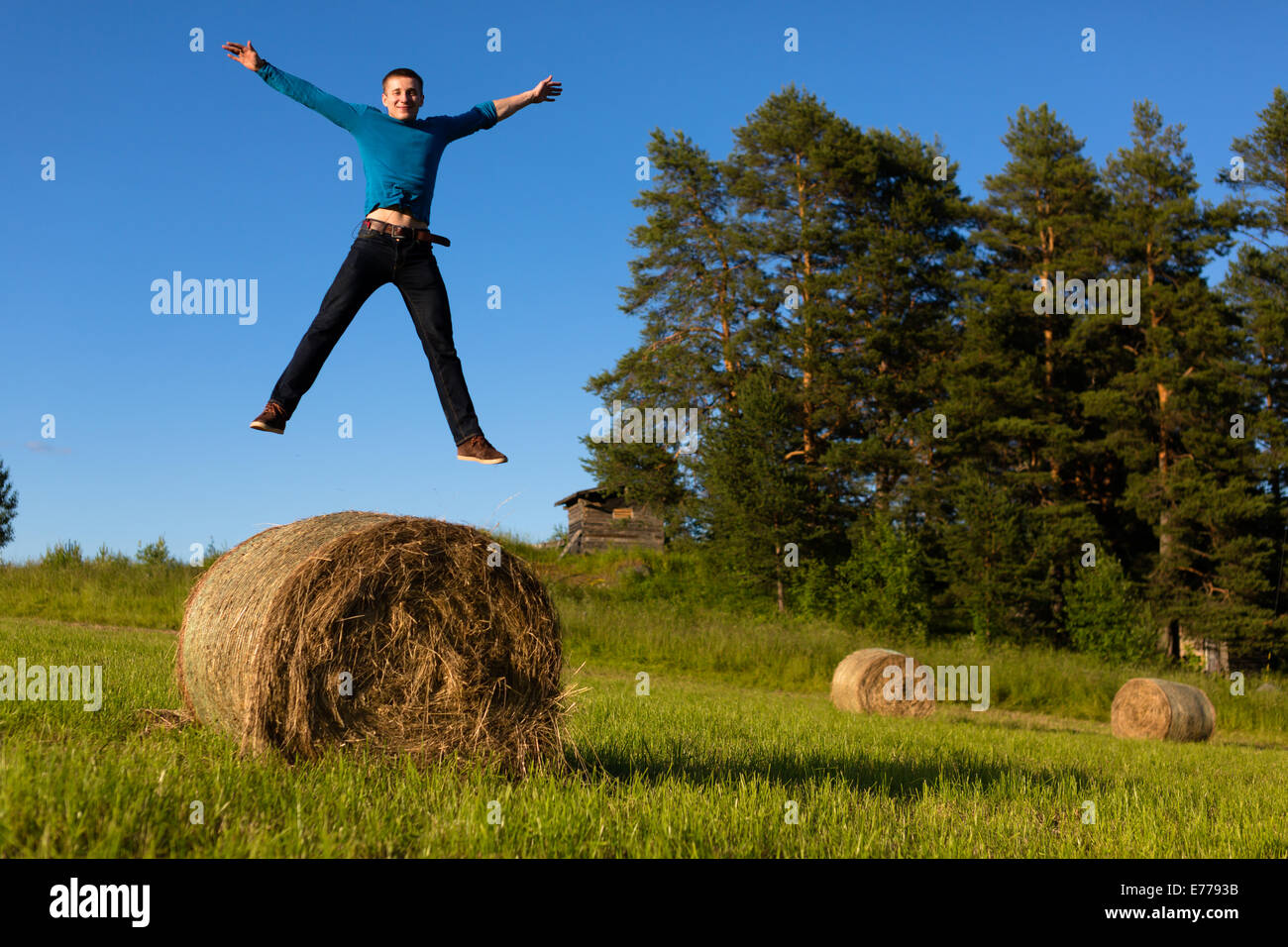 Man jumping in a field Stock Photo