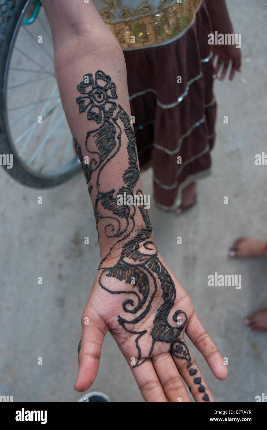 Girl showing off black henna decoration, Jojawar, Rajasthan, India. Stock Photo