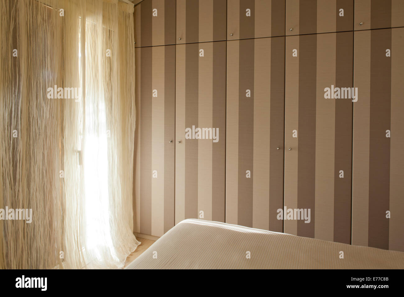 MASTER BEDROOM WARDROBE COVERED WITH STRIPED WALLPAPER Stock Photo Alamy