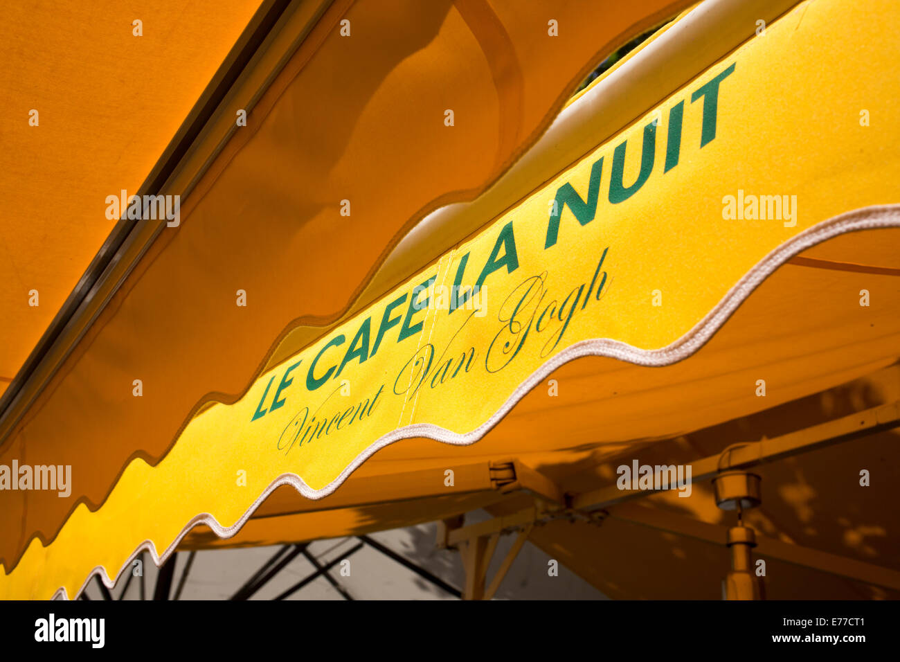 Yellow awnings of Le Cafe la Nuit in Arles Provence France Stock Photo