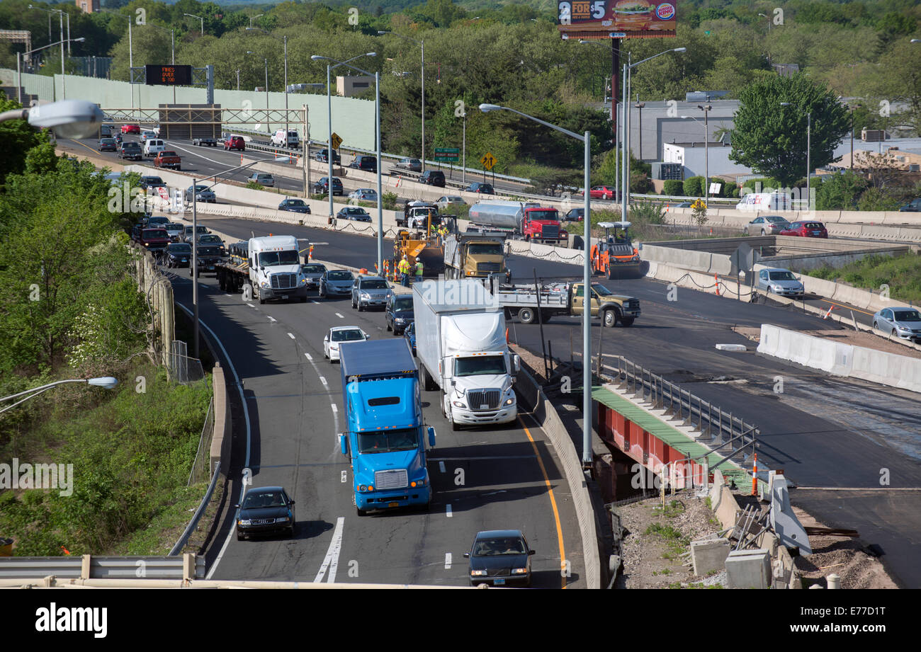 Highway traffic flows by ongoing construction on New Haven Harbor Crossing Project. Stock Photo
