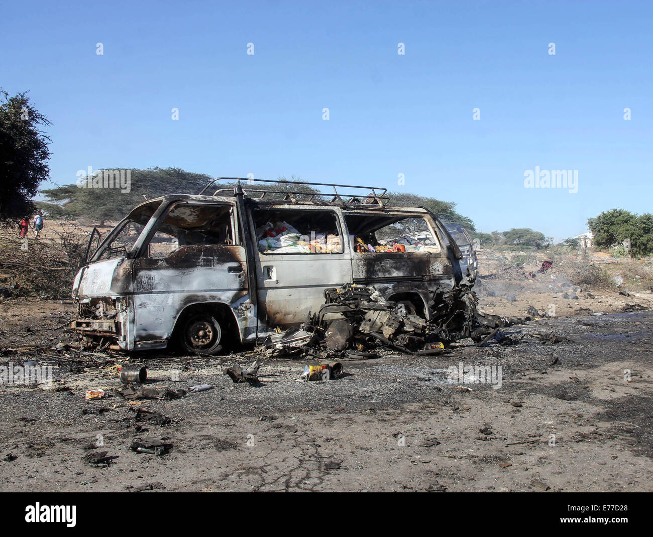 Mogadishu. 8th Sep, 2014. Photo taken on Sept. 8, 2014 shows the site of a suicide carbomb targeting a convoy of the African Union Mission in Somalia (AMISOM) on a road linking Mogadishu and Afgooye, a small town 20 km west of the capital. Islamist group Al-Shabaab on Monday claimed responsibility for twin suicide car bomb attacks that killed at least 12 people in Somalia, police sources said. The other suicide carbomb blast hit a military checkpoint on the outskirts of Mogadishu on Monday, injuring two people including a local government official. Credit:  Faisal Isse/Xinhua/Alamy Live News Stock Photo