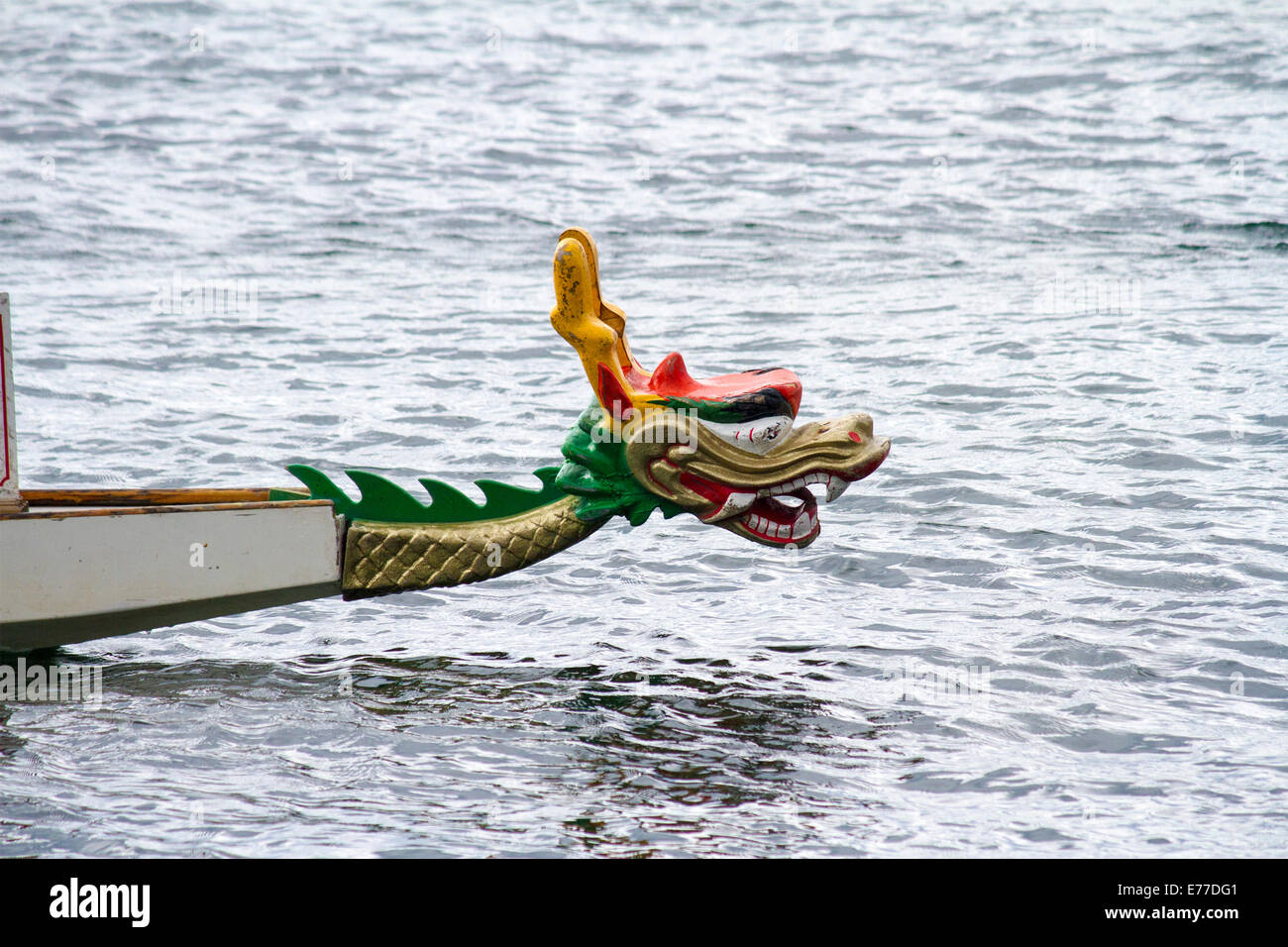 Head of a dragon painted on the bow of a dragon boat. Stock Photo