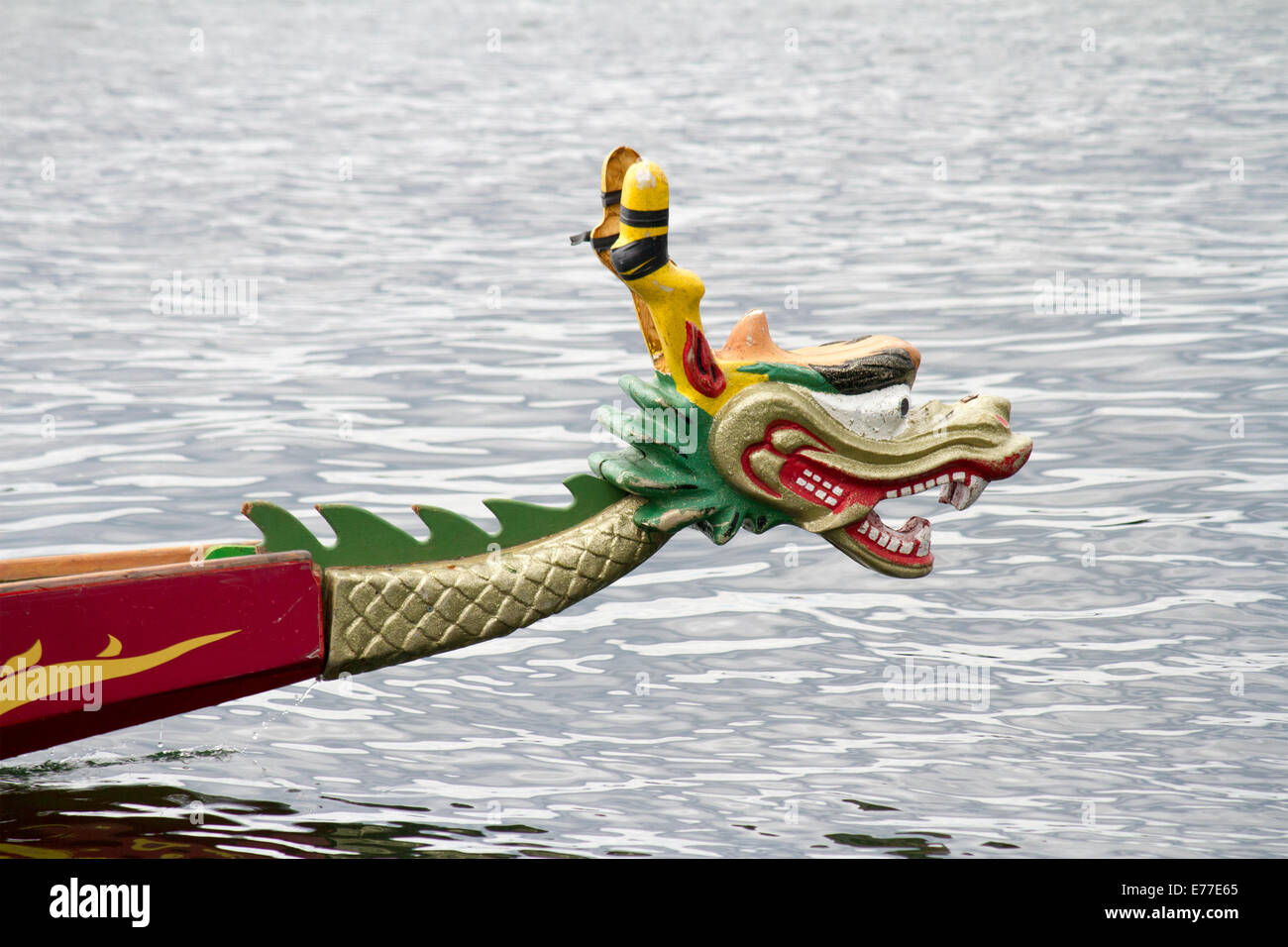 Dragon head at the bow of a dragon boat going through the water on Lake Ontario in Toronto, Canada Stock Photo