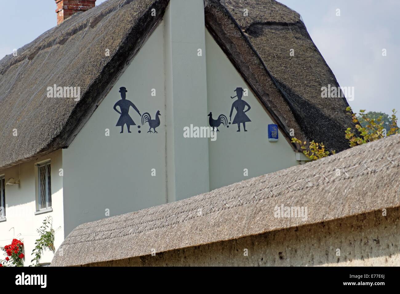 House art on thatched cottage Stock Photo