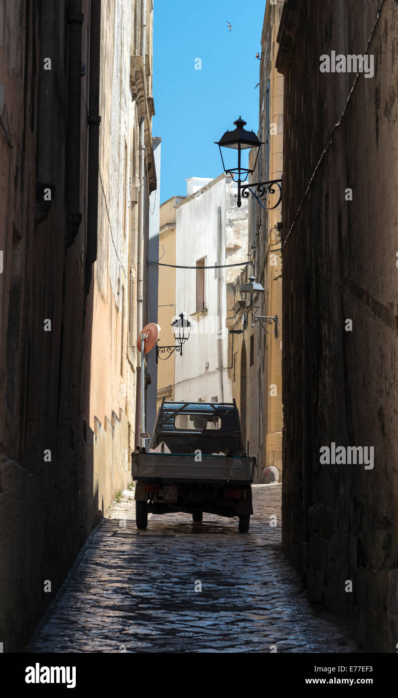 A Piaggio truck negotiates a narrow alleyway in the old town of , Puglia, Southern Italy Stock Photo