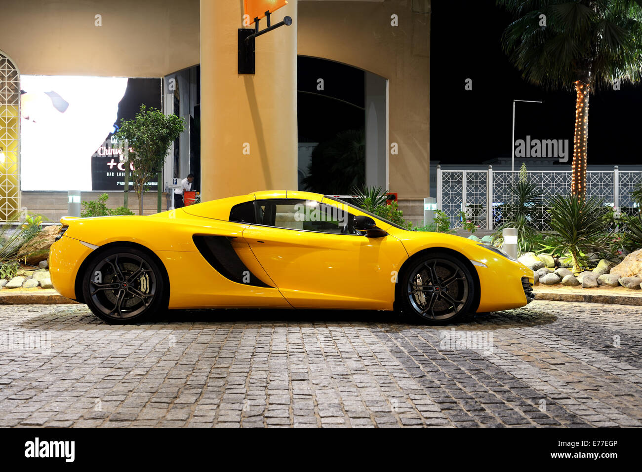 The luxury sport car is on the Walk at Jumeirah Beach Residence, Dubai, UAE Stock Photo