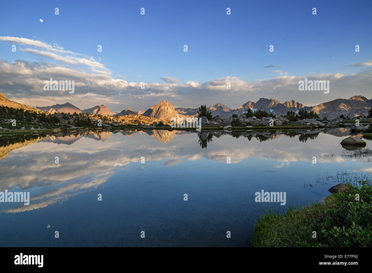 evening reflection of the Hermit and other mountains in a Sierra Nevada mountain lake Stock Photo