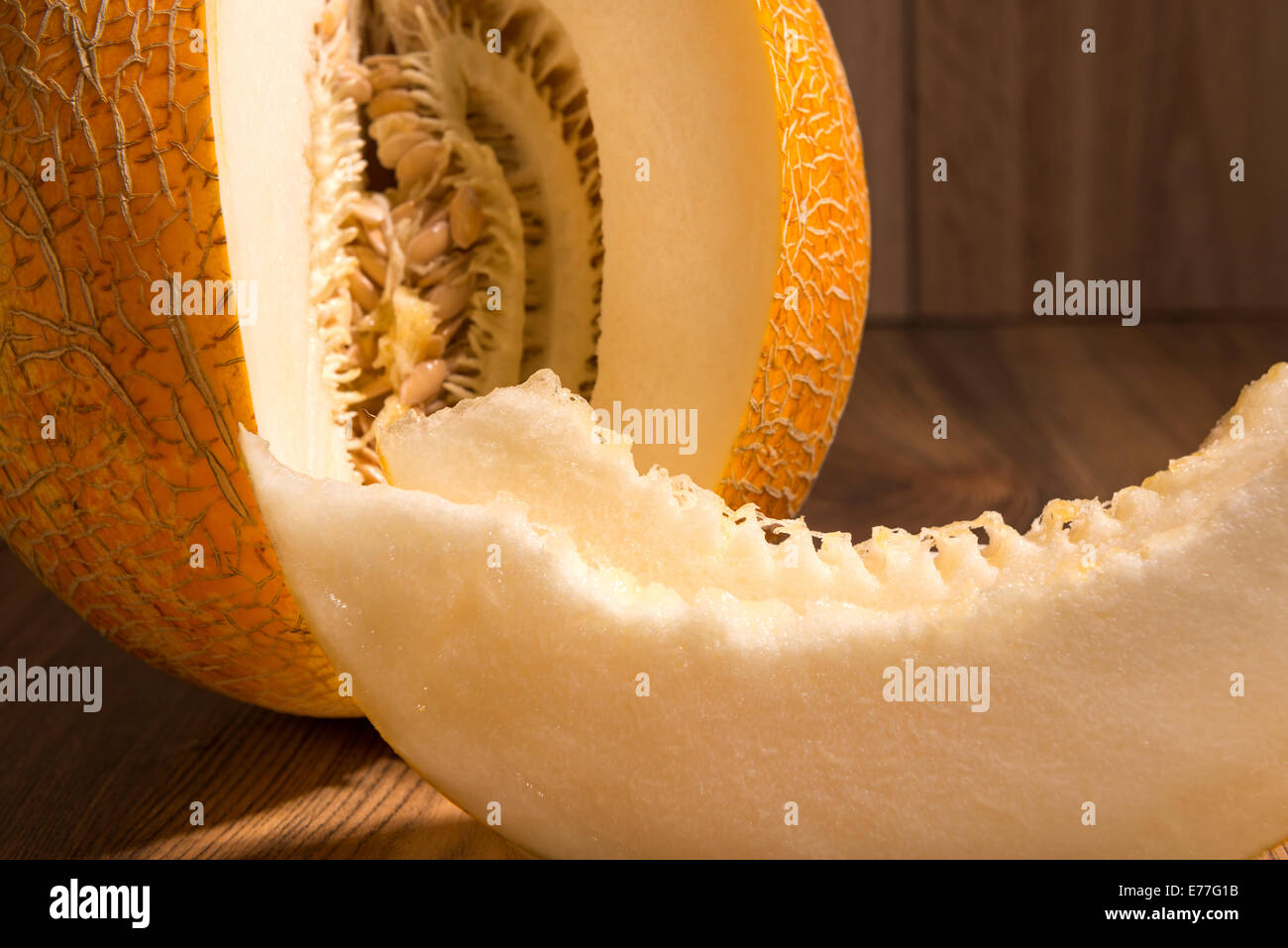 yellow netted melon - the fruit and slices Stock Photo