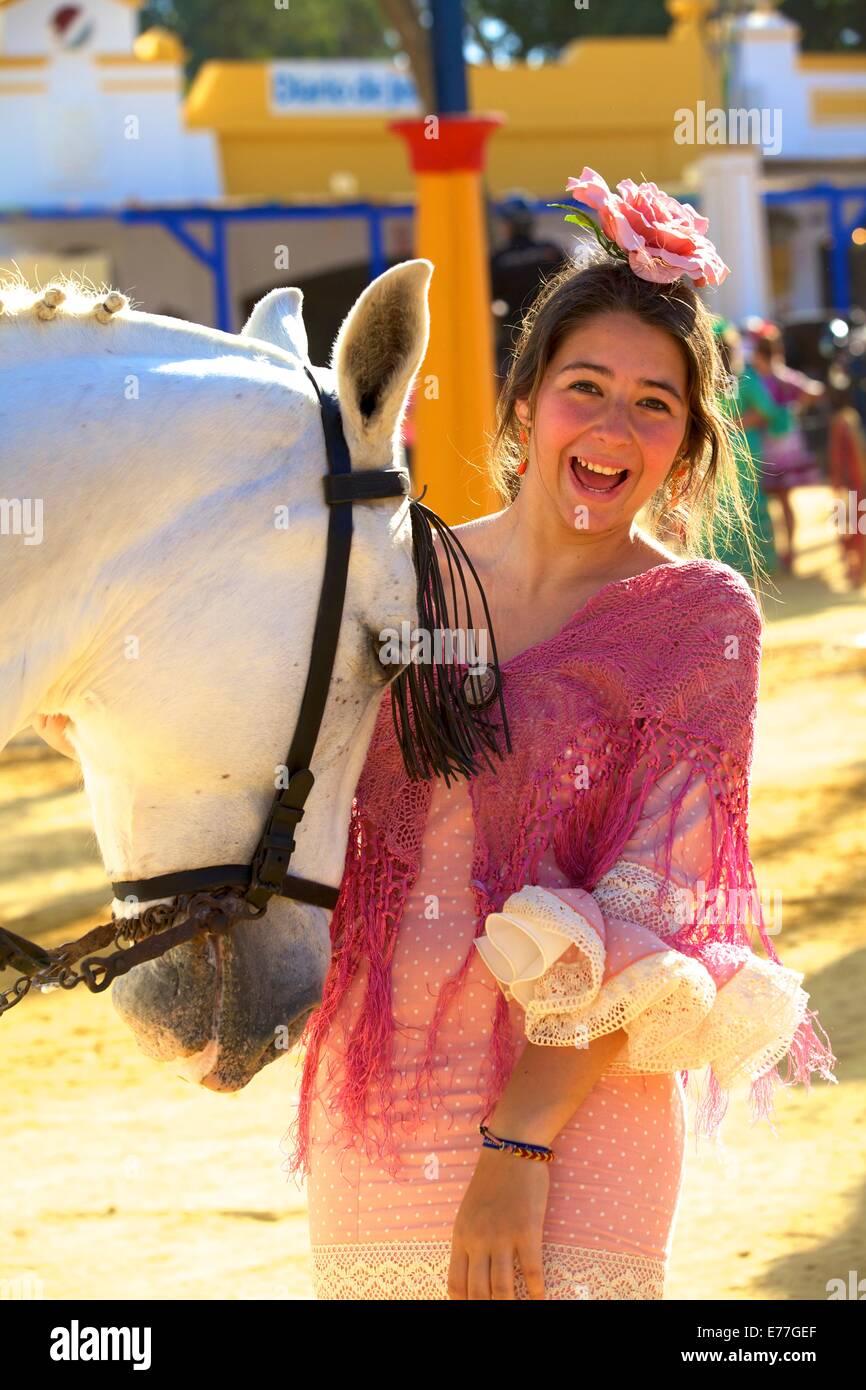 Girl in Traditional Spanish Costume with Horse, Annual Horse Fair, Jerez de la Frontera, Cadiz Province, Andalusia, Spain Stock Photo